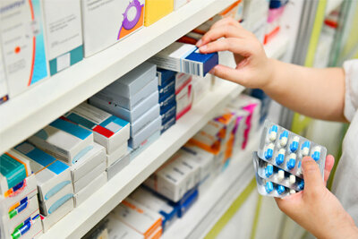 Pharmacist dispensing medication at Windwood Chemist, Askew Road
